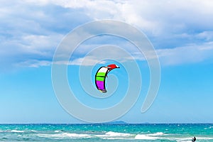 Kite surfer under a cloudy sky