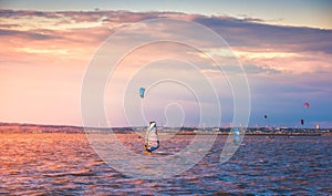 Kite Surfers and Wind Surfer at Sunset