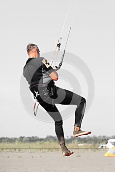 Kite surfing man practicing.