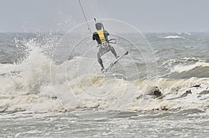 Kite surfing in spray.