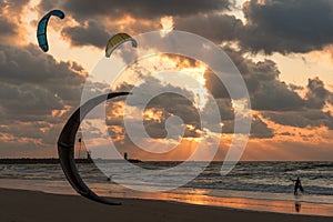 Kite surfing in the sunset at Dutch beach