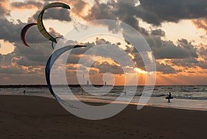 Kite surfing in the sunset at Dutch beach