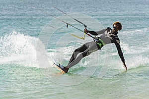 Kiteboarder dipping hand Boa Vista