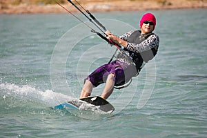 Kiteboarder enjoy surfing