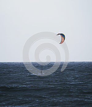 Kiteboarder kitesurfer extreme water sport at Belgium Pier in Blankenberge north sea atlantic ocean West Flanders