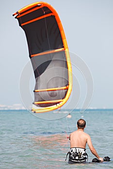 Kiteboarder lifting kite