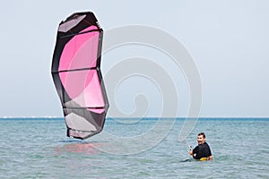 Kiteboarder lifting kite