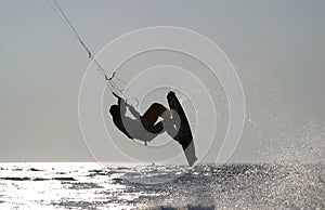 Kiteboarder taking off for a jump