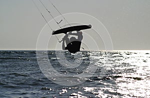 Kiteboarder upside down jump