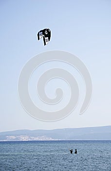 OMIS, CROATIA, SEPTEMBER 18, 2020 - Tourists enjoying kitesurfing during a windy sunny day in Omis Resort, Croatia.