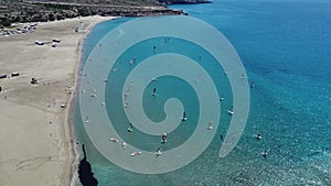 Kiteboarding, Kitesurfing and Kiteboarder is Pulled Across Sea Water Greece