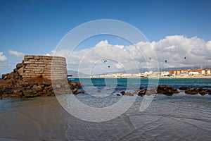 Kiteboarding (kitesurfing) on the windy beach in Tarifa