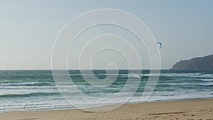 Kiteboarding - sailing surf on the coast of the Atlantic Ocean.