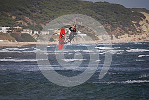 Kiter flying on the waves near Tarifa, Spain