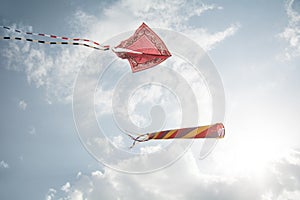 Kites and cloudy sky