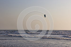 Kitesurf at sea on a sunset, Arambol beach, Goa, India