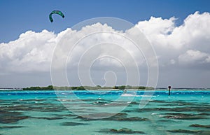 Kitesurfer on a blue lagoon