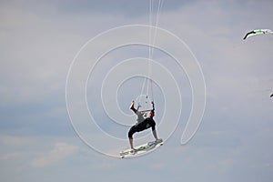 Kitesurfer jumping high