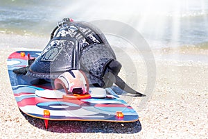 Kitesurfer prepating his equipment on the beach. trapezium and board at sunny day