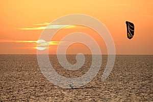 Kitesurfer at sunset