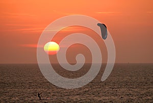 Kitesurfer at sunset