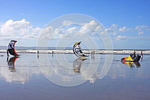 Kitesurfers on a beach