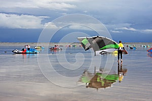 Kitesurfers on a beach