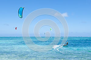 Kitesurfers on clear blue tropical lagoon water, Okinawa, Japan