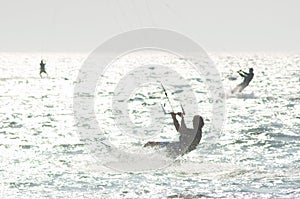 Kitesurfers in water photo