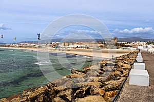 Kitesurfers, ocean and beach. Tarifa, Andalusia, Spain photo