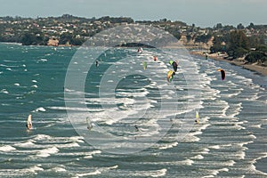 Kitesurfers in Omaha Bay in New Zealand photo