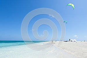 Kitesurfers preparing on tropical beach, Okinawa, Japan