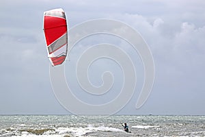 Kitesurfers in the waves