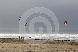 Kitesurfers on Saunton Sands beach photo