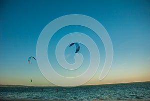 Kitesurfing. Evening landscape of a small island and the sea. Boracay, Philippines.