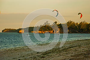 Kitesurfing. Evening landscape of a small island and the sea. Boracay, Philippines.