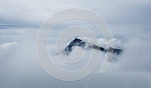 Kitzbuhel mountain peak in the mist, Tirol