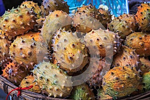 Kivano known as horned melon looks like cucumber on the counter of the Chinese market.