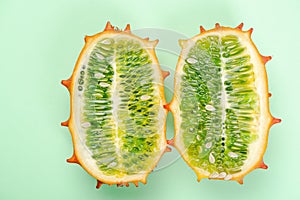 Kiwano or Horned Melon Fruit Cut in Half. Exotic Fruit. Detail Close Up. Pastel Background