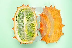 Kiwano or Horned Melon Fruit Cut in Half. Exotic Fruit. Detail Close Up. Pastel Background