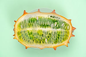 Kiwano or Horned Melon Fruit Cut in Half. Exotic Fruit. Detail Close Up. Pastel Background