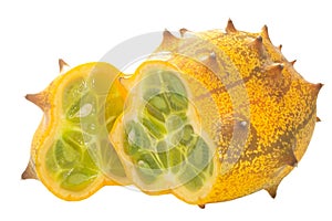 Kiwano or Horned Melon isolated.  Ripe cut Cucumis metuliferus pepo fruit