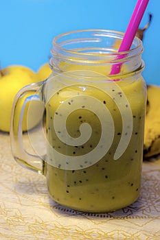 Kiwi, apple and pear vertical smoothie photo