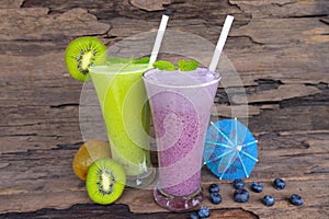 Kiwi and blueberry  smoothies colorful fruit juice milkshake blend beverage healthy .