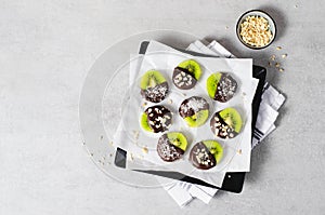 Kiwi Coved In Chocolate, Healthy Snack on Bright Background