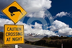 Kiwi Crossing road sign and volcano Ruapehu, NZ