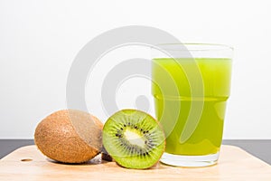 Kiwi on cutting board with white background