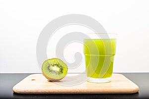 Kiwi on cutting board with white background