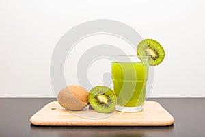 Kiwi on cutting board with white background