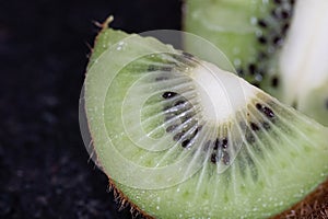 Kiwi fruit cutted. Healthy fruit kiwi cut for healthy fruit based nutrition. Green fruit with seeds, healthy and fresh diet for